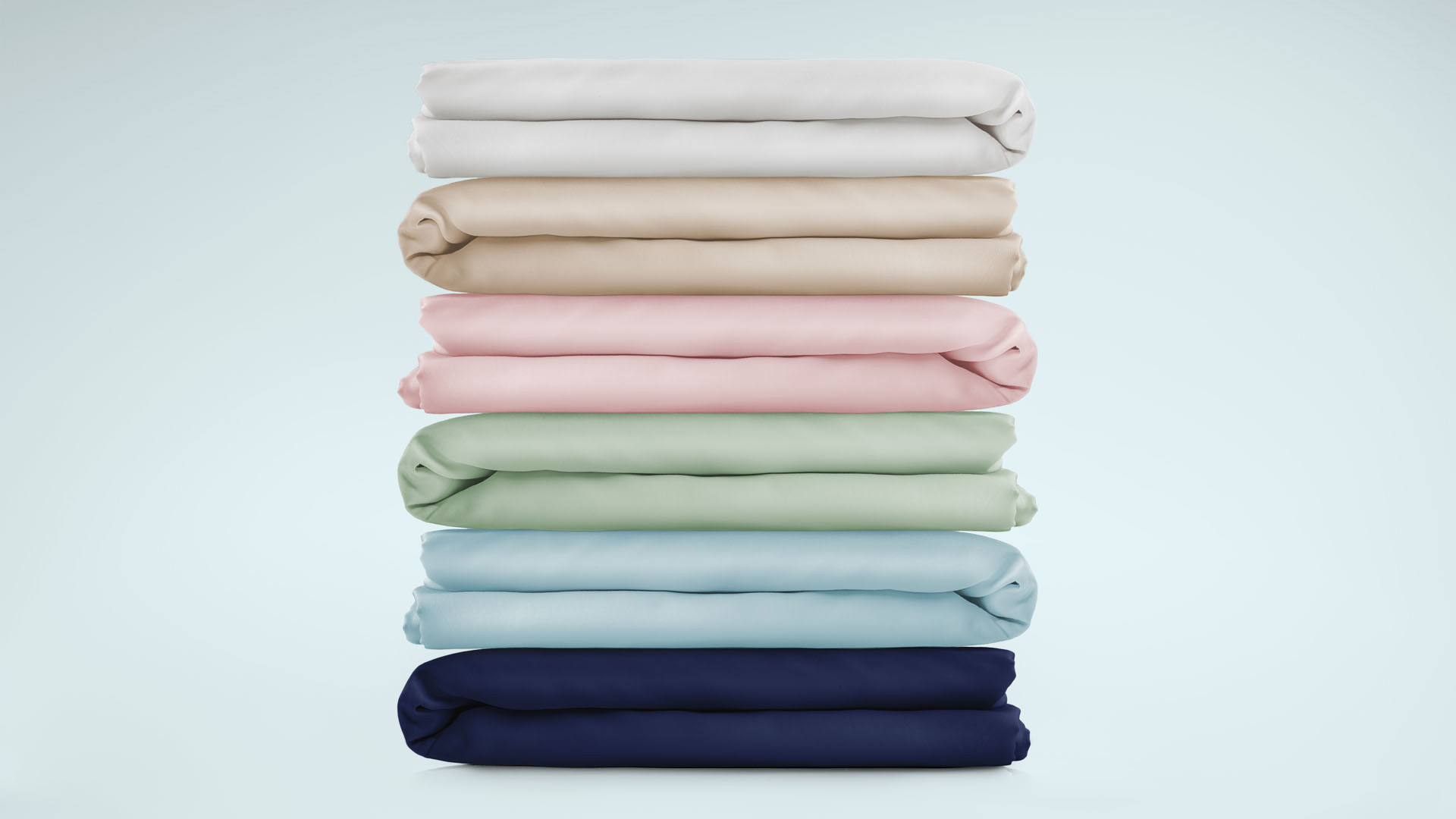 Folded fitted sheets on top of each other