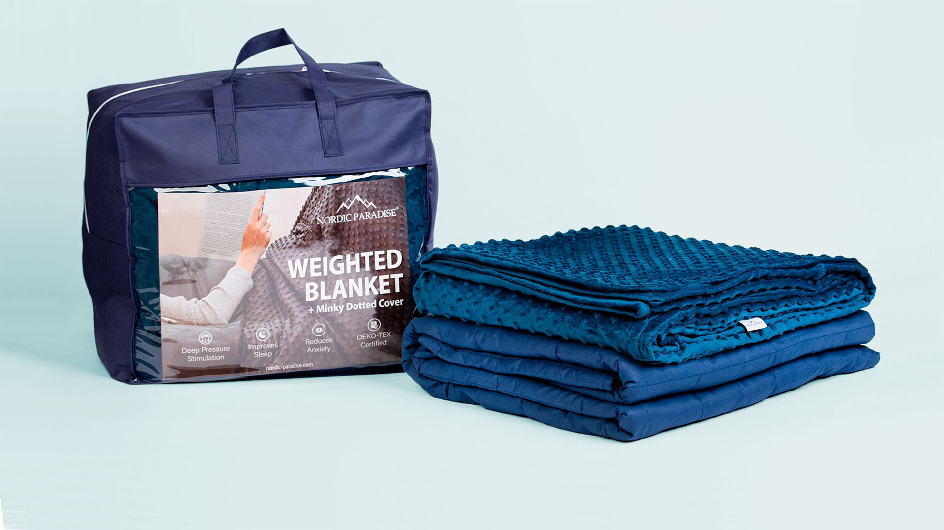 Folded blue weighted blanket with a minky dotted cover and a packaging on blue background