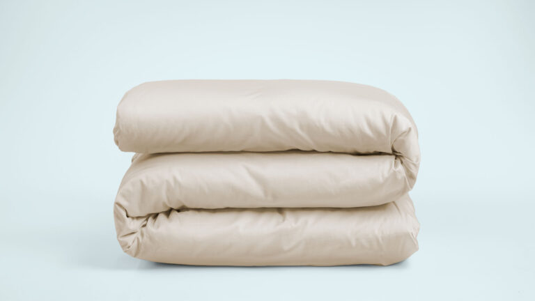 Folded duvet with a beige duvet cover